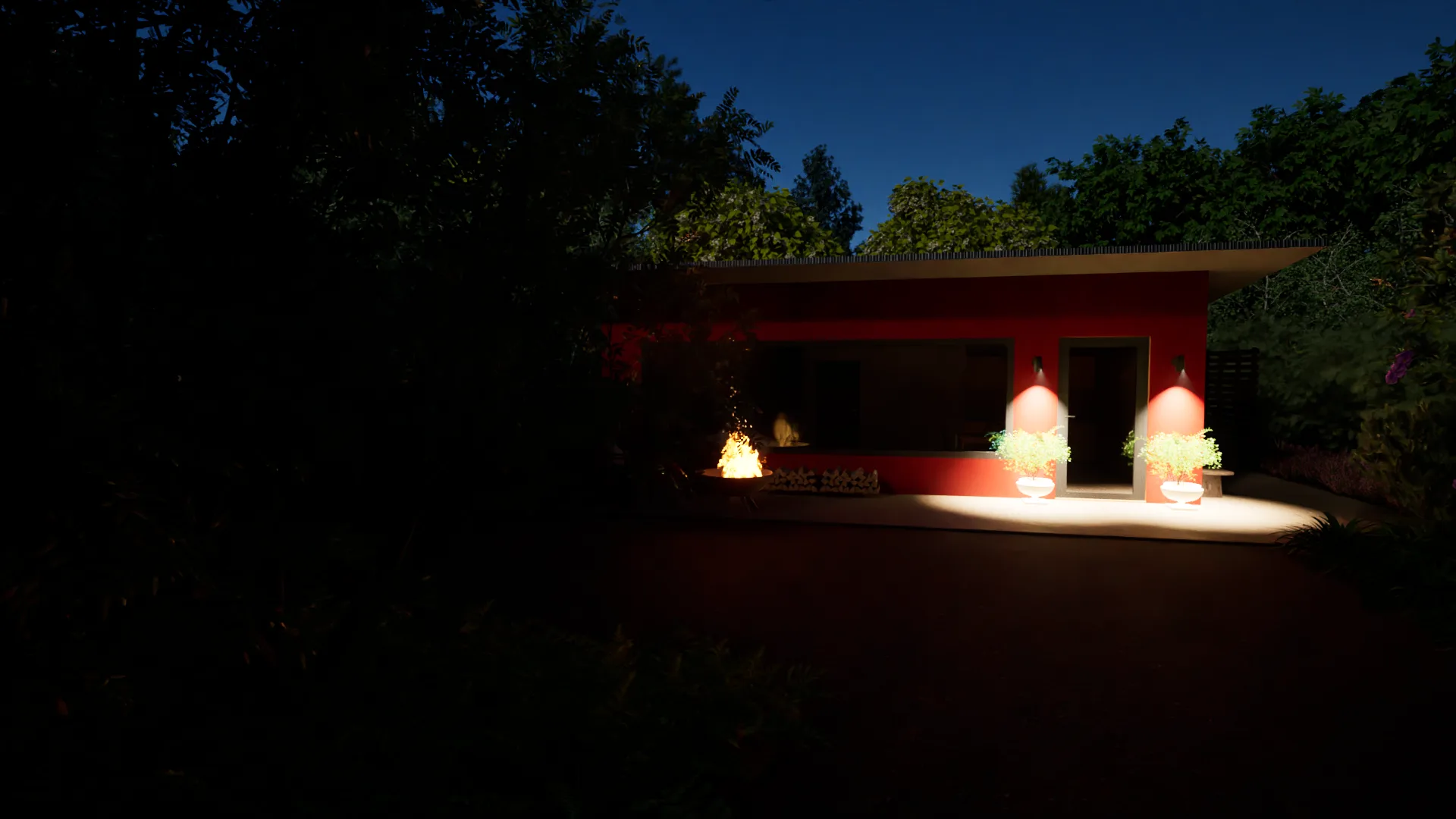The pavilion at night, warm light spilling onto the patio